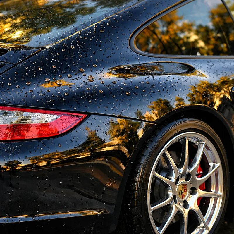 Hand washing a vehicle exterior during car detailing in Ellis County, Texas
